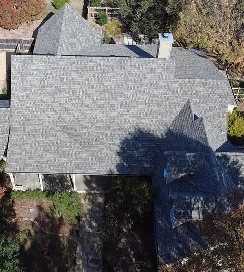 Completed light gray shingle roof, aerial drone view
